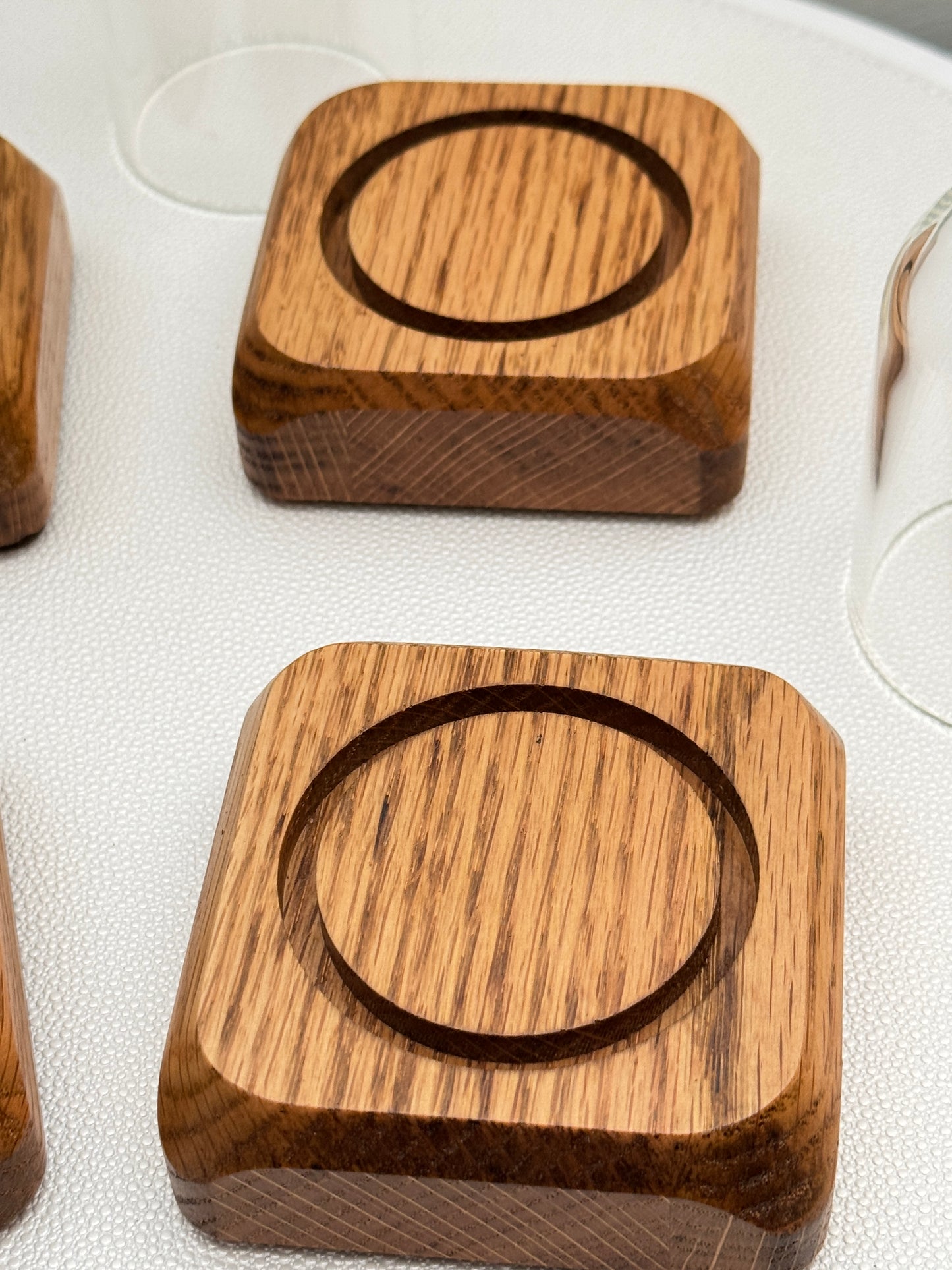 Four small Oak Displays with glass domes