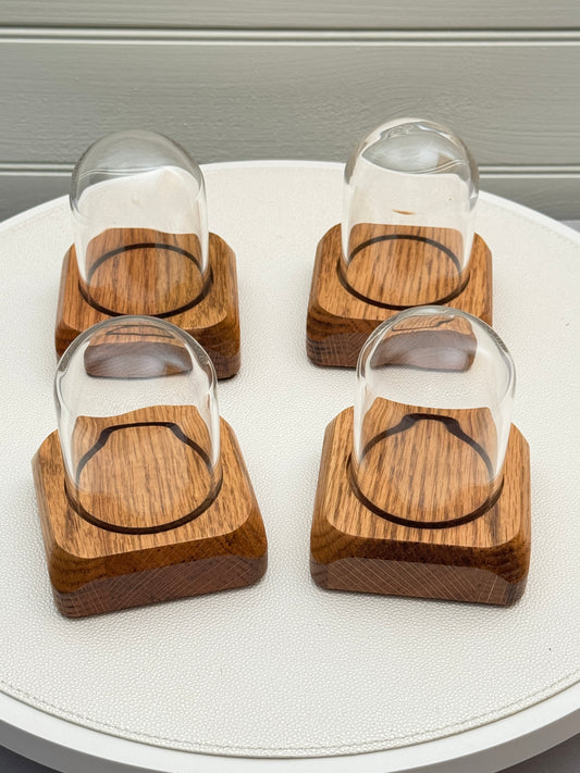 Four small Oak Displays with glass domes
